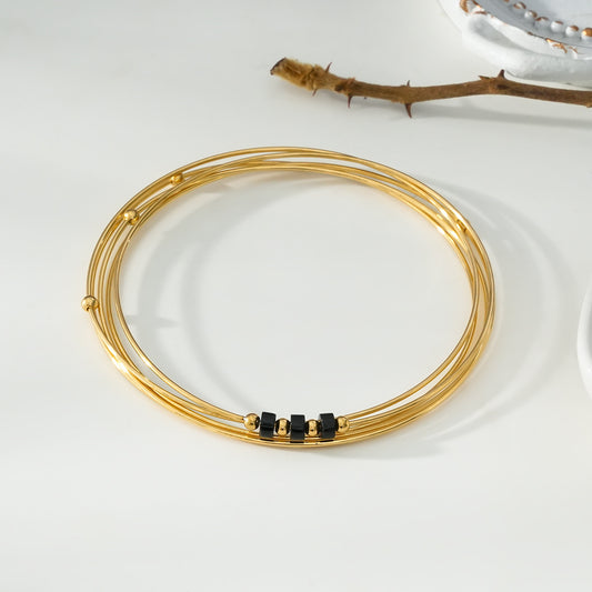 Bracelet Doré Jonc Multi Couches Avec Perles Noires Et Dorées