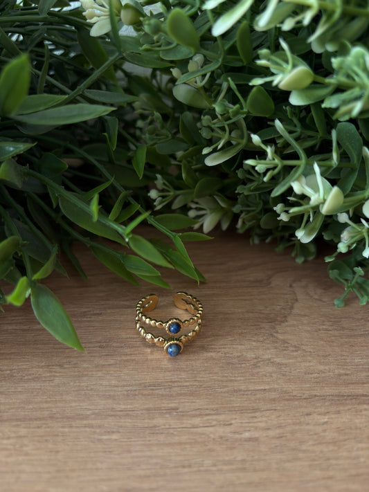 Bague doré, pierres bleues
